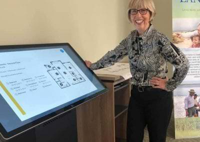 A future resident uses the virtual tour board to check out the Trinity Landing residences.
